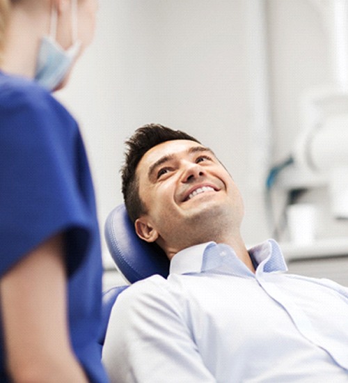 Man smiling while talking to sedation dentist in San Ramon