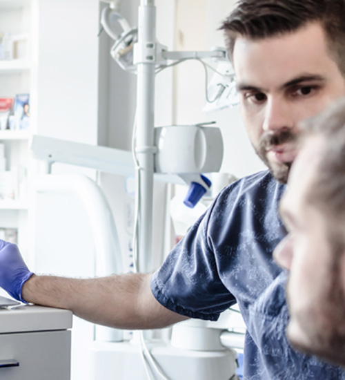 Dentist reviewing patient’s X-rays 