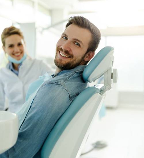 Happy dental patient looking to the side