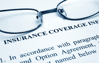 glasses on a dental insurance form