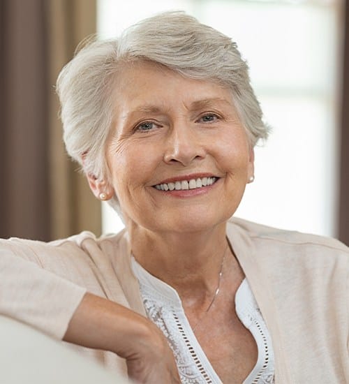 Older woman with dentures smiling