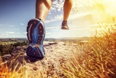 Person running on a trail