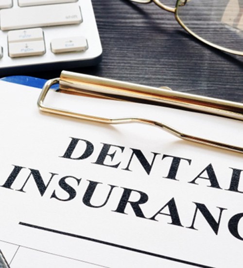 Dental insurance form resting on a table
