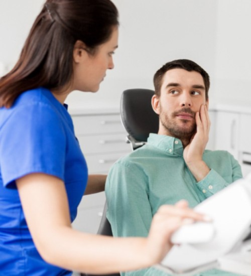 Emergency dentist in San Ramon speaking to a patient
