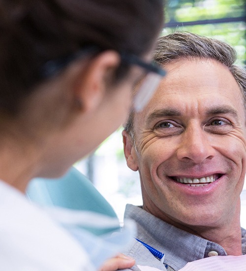 patient talking to his dentist