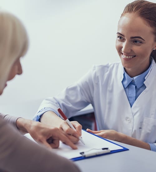 Dentist explaining dental insurance coverage to patient