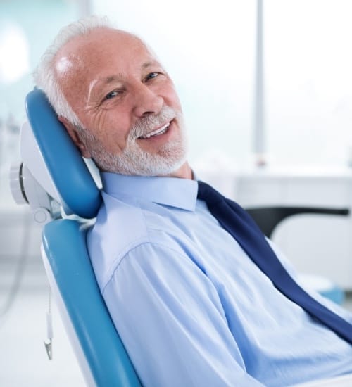 Man smiling after scaling and root planing treatment