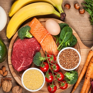 A variety of healthy food sitting on a wood table