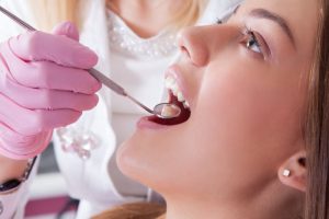 Woman having dental examination.