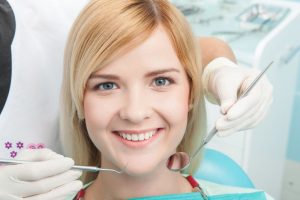 Smiling woman in the dental chair