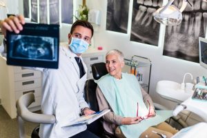 Woman smiling during her visit to the dentist’s office